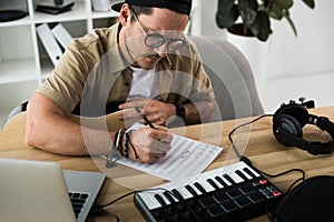 Young musician writing notes