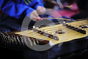 Young musicians playing dulcimer on concert