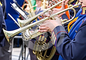 Young musicians plays on trumpets at music festival