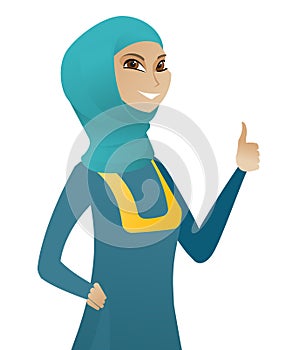 Young muslim business woman giving thumb up.