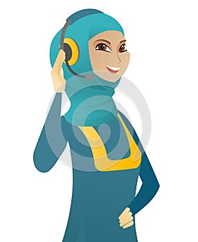 Young muslim customer service operator in headset.