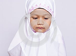 Young muslim girl praying