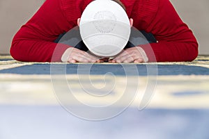 Young muslim man showing Islamic prayer