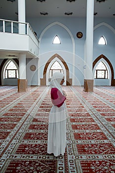 Young muslim pray in mosque