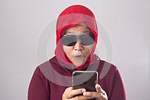 Young Muslim Woman Get Good News on Her Phone