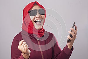 Young Muslim Woman Get Good News on Her Phone