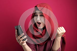Young Muslim Woman Get Good News on Her Phone