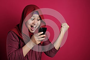 Young Muslim Woman Get Good News on Her Phone