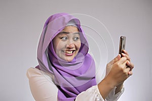 Young Muslim Woman Get Shock Surprised Get Good News on Her Phone