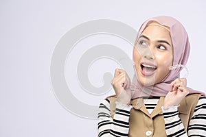 Young muslim woman holding invisalign braces in studio, dental healthcare and Orthodontic concept photo