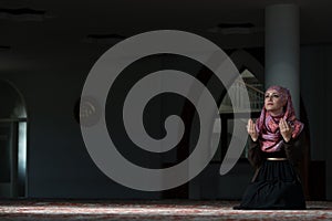 Young Muslim Women Praying In Mosque