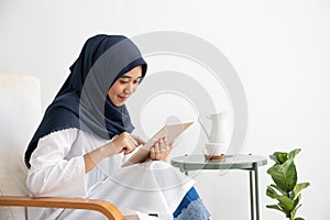 Young Muslim women Students is a creative freelance journalist sit writing to be entrepreneur job concept for hijab girl Islam