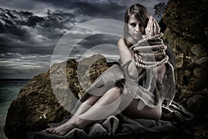 Woman with tied up hands photo