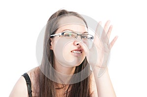 Young natural teen making funny face using hand