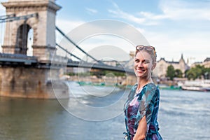 Young natural woman smiling at Danube, Budapest, Hungary