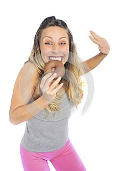 Young naughty woman eating chocolate donut happy guilty for unhealthy nutrition