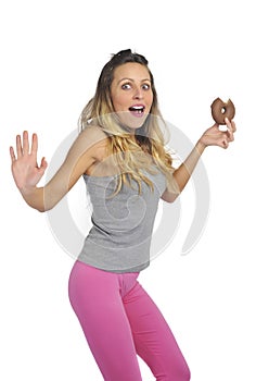 Young naughty woman eating chocolate donut happy guilty for unhealthy nutrition