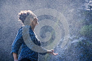 Young Nepalese woman in water spray