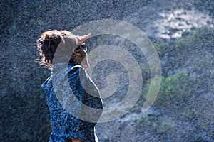 Young Nepalese woman in water spray
