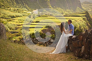 Young newly wedded couple in honneymoon on Flores island, Azores photo