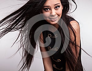 Young nice asian girl poses in studio.