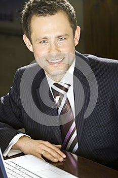 Young handsome succesful businessman smiling