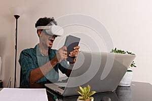 Young Nomad on a Teleworking Meeting at Desk With Laptop