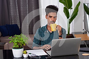 Young Nomad Travel at Teleworking Desk With Laptop