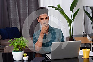 Young Nomad Travel at Teleworking Desk With Laptop