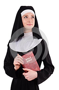 Young nun with bible isolated