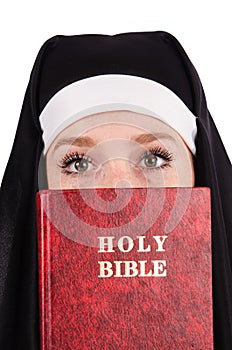 Young nun with bible isolated