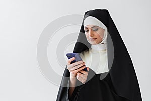young nun in black vestment messaging photo