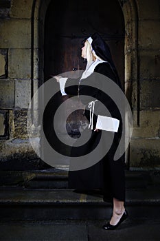 Young nun nearby church