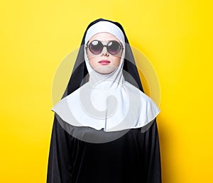 Young nun with sunglasses