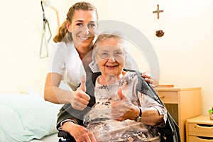 Young nurse and female senior in nursing home