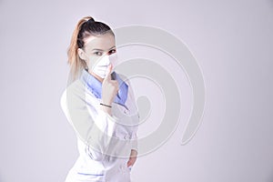 Young nurse gesture silence please