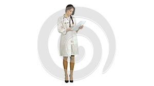 Young nurse reading patient medical history forms on white background
