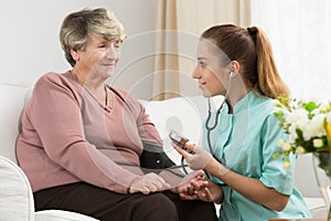 Young nurse with senior lady