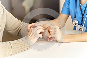 A young nurse shows care and professionalism in relation to an elderly woman