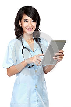 Young nurse smiling while working