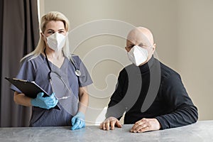 Young nurse taking care of old sick man