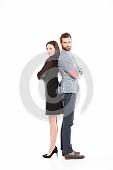 Young offended loving couple standing isolated