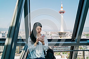 Young office lady checking the timetable