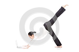 Young office woman in yoga pose holding laptop on white background