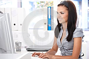 Young office worker at desk