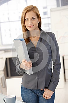 Young office worker woman with folder