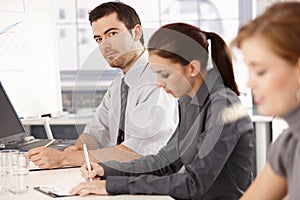 Young office workers having business training