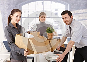 Young office workers moving office