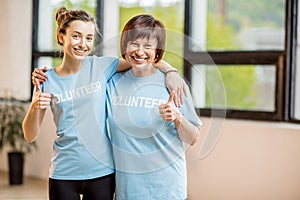 Young and older volunteers indoors