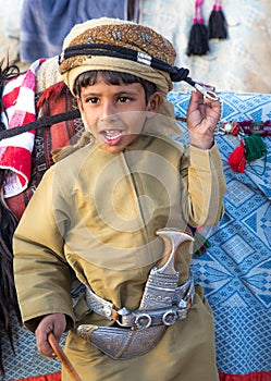 Young Omani boy dressed in traditional clothing.